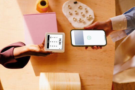 Contactless payment with phone at jewelry business counter
