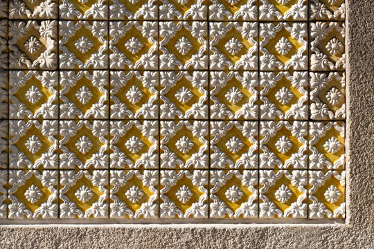 Decorative ceramic tile pattern in warm sunlight
