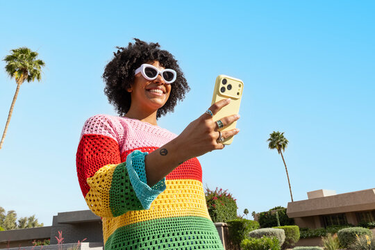 Black woman Fashion smile Portrait cell phone palm tree 