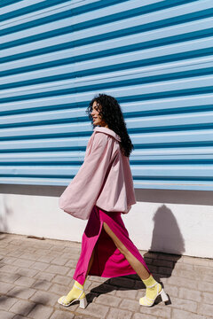 Woman walking urban street