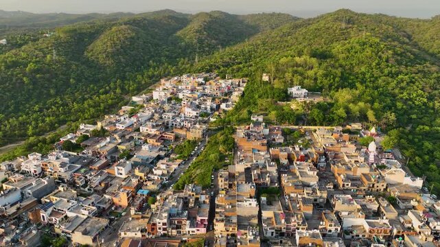 Dense overpopulation and urban development destroying green cover.