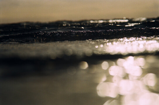 Waves roll in at sunset on a beach