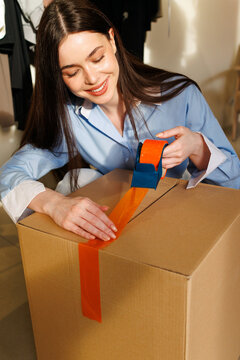 Entrepreneur Woman Prepares Ecommerce Package in Office