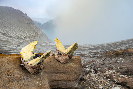 Sulfur mining baskets at volcanic crater in Ijen Indonesia