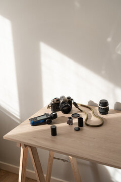Analog photography tools in natural sunlight minimalist interior