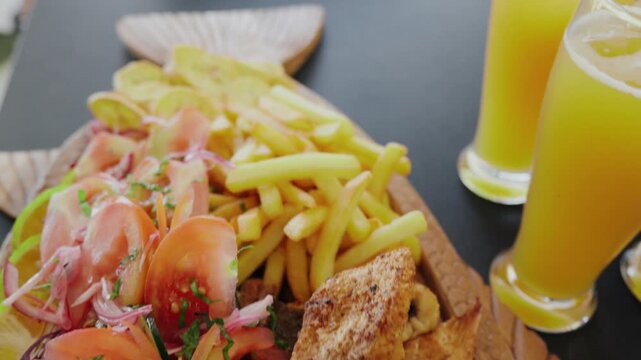 Delicious peruvian jalea mixta seafood platter served with beer