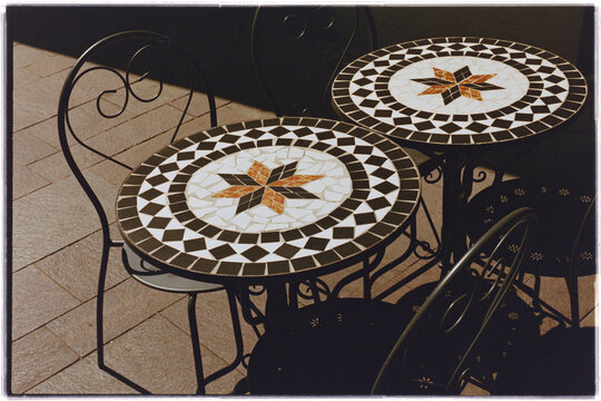 Mosaic Bistro Tables and Wrought Iron Chairs