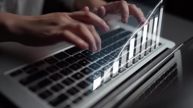 A close-up image showcasing hands typing on a laptop keyboard. The reflection on the screen displays a digital graph, symbolizing data analysis and modern technology. Copula