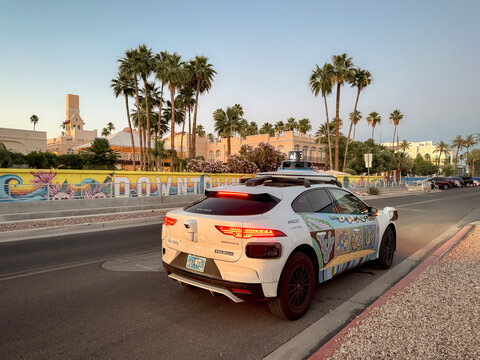 Chandler, Arizona, USA - May 8, 2026: A Waymo self driving taxi vehicle parked on the street Chandler during golden hour in the Phoenix metropolitan area.

