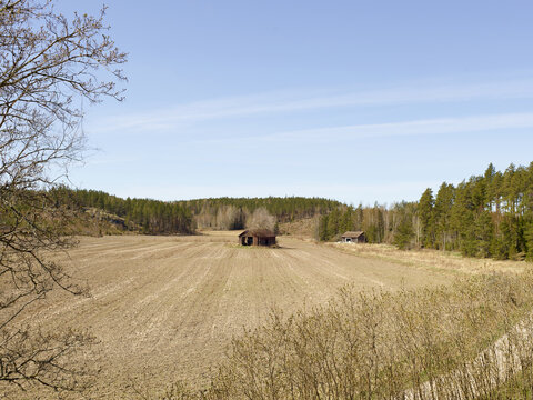 typical old finnish barn during spring in finland