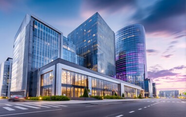 Fototapeta premium Modern Office Building Exterior with Unique Architectural Arc Design under a Colorful Sunset Sky