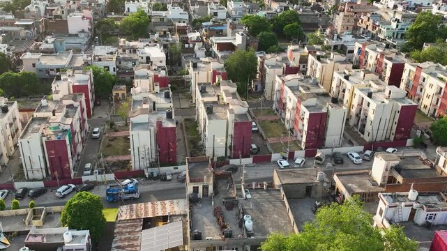 Aerial lateral tracking and orbit of residential colony in India.
