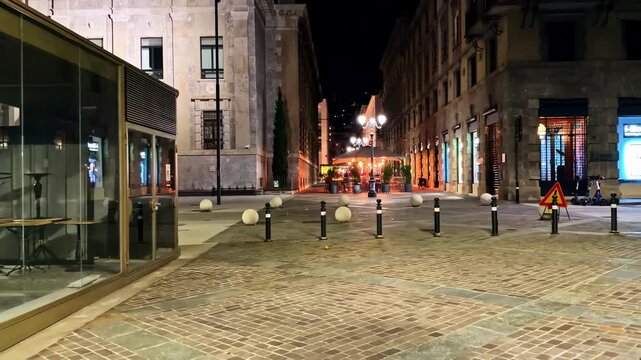 POV Walking Through Quiet Empty Cobblestone Street at Night in Bergamo Capturing the Mysterious and Cinematic Atmosphere of an Italian City After Dark