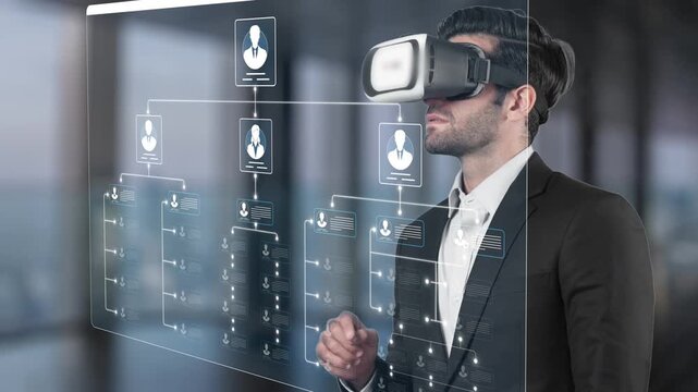 Professional man using virtual reality headset for innovative technology experience while interacting with digital interfaces and organizational charts in modern office environment Sigmoid