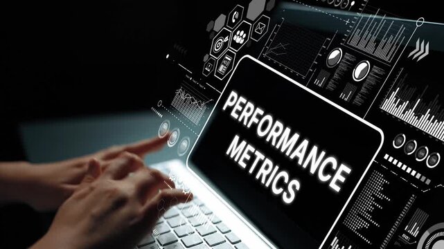 Hands Typing on Laptop with Digital Performance Metrics Dashboard Displayed on Screen in Dark Environment. Asymptotic smart data analytic.