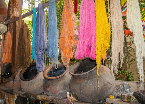 Finished yarn and clay pots for natural dyes used to make ikat makcanas (scarves) in Ecuador