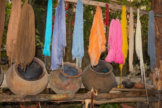 Finished yarn and clay pots for natural dyes used to make ikat makcanas (scarves) in Ecuador