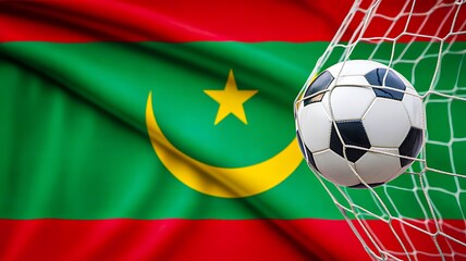 Fototapeta premium Soccer ball in goal net with mauritania flag waving background