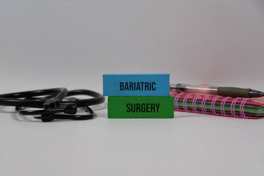 Bariatric Surgery Concept With Stethoscope Notebook And Pen On white Background For Weight Loss.