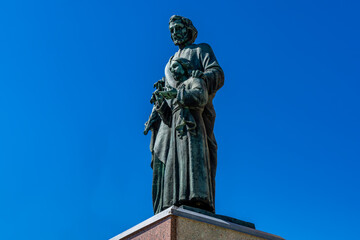 Fototapeta premium Historic Saint Joseph's statue at the Catholic Church in Stratford, Ontario, established in the 1860s with traditional ecclesiastical architecture and spiritual importance to the local community.