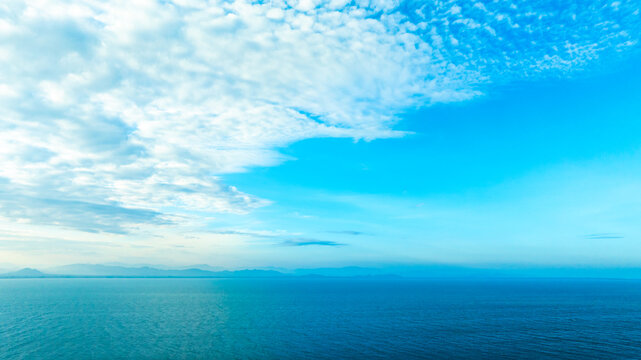 Tropical Nature clear sky and summer sea water under a clear blue sky with beautiful clouds and bright sunlight. Perfect for summer vacation and travel background