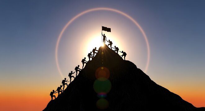Silhouettes of business team climbing mountain peak with leader holding flag at sunset.