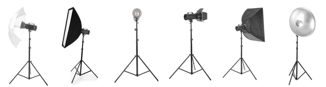 Professional photography studio lighting equipment collection with softboxes, umbrellas, and reflectors on stands