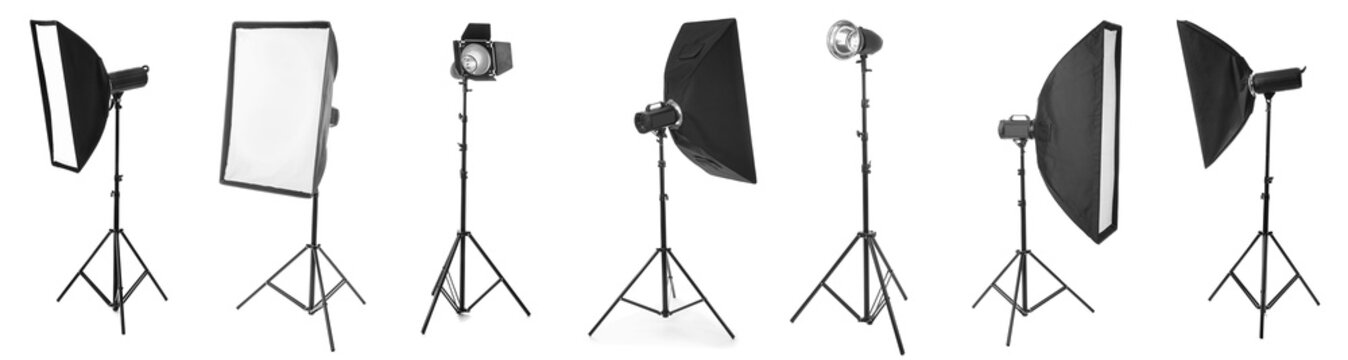 Professional photography studio lighting equipment collection with softboxes and strobe lights on tripods, the setup includes various softboxes and strobe lights mounted on adjustable tripods