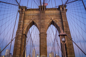 Fototapeta premium Photo of Brooklyn Bridge during the beautiful sunrise in Manhattan, NYC, United States of America. 