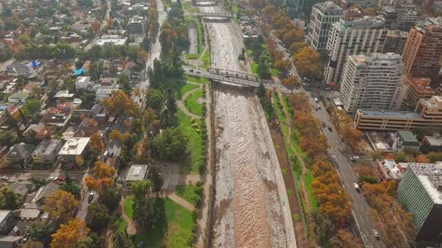 Aerial Flight Dolly In Mapocho River and City Bridge Traffic Santiago de Chile 60 FPS