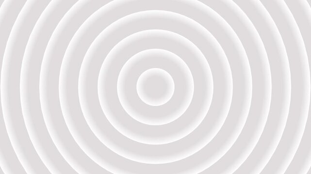 A clean, bright white background is filled with concentric circles creating a subtle ripple or target effect with soft shadows and highlights, offering a minimalist and abstract visual for