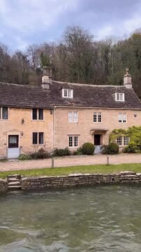 houses on the river of Castle Combe, a village in Wiltshire on the edge of the Cotswolds in England.
