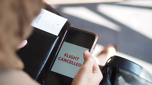Flight cancellation notice seen on smartphone screen