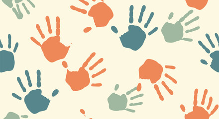 Fototapeta premium Seamless pattern of colorful paint handprints scattered on a light cream background for a child concept.