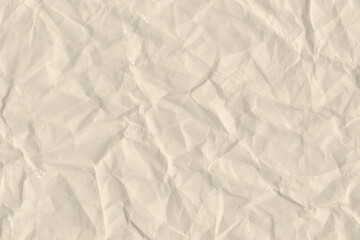 Fototapeta premium Crumpled beige paper texture background. Wrinkled blank cream off white sheet backdrop pattern for rustic vintage graphic design mockup.