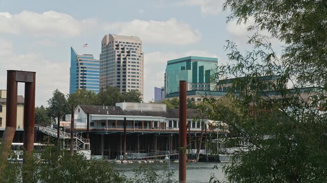 Modern urban skyline above Sacramento riverfront waterfront shows the downtown business district with office buildings and waterfront architecture