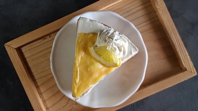 Lemon blueberry cake on rustic wooden serving tray