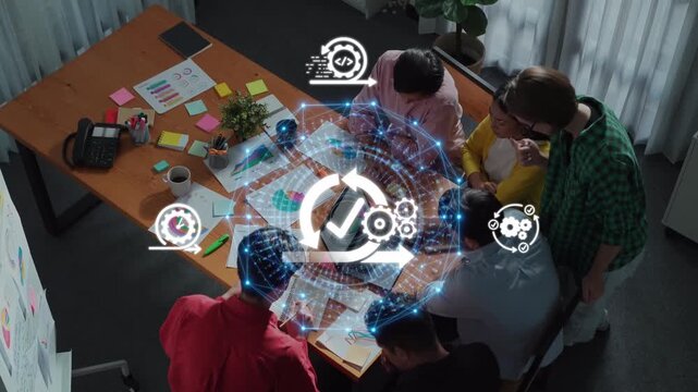 A diverse team collaborates in a modern office, utilizing digital tools and visual data to enhance creativity and strategy in project development. Raster