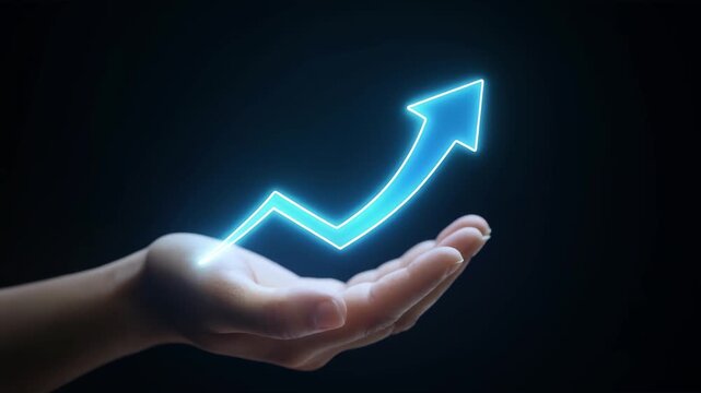 Hand holding glowing neon upward arrow representing growth and success on dark background
