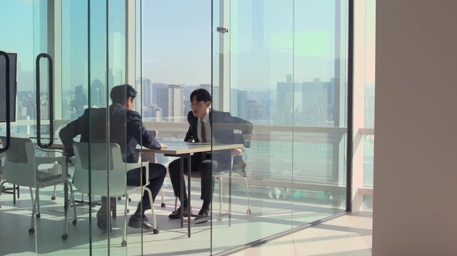 Two professional businessmen shaking hands in a modern glass office with a panoramic city skyline view, symbolizing successful partnership, agreement, and corporate collaboration.