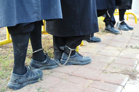 Arrested Ultra-Orthodox (Haredi) Jewish men with leg shackles