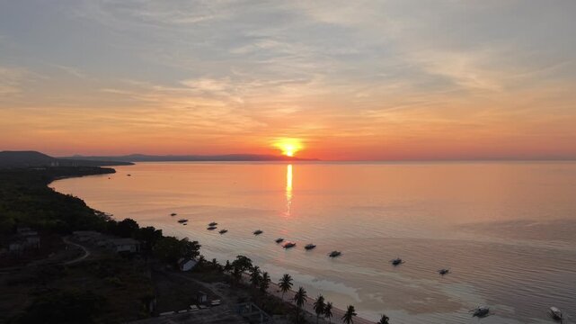 Aerial Rising Reveal of Panglao Coastline at Golden Sunrise