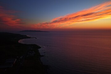 Obraz premium Aerial drone photo of Teuri Island at sunset from Yagishiri Island, Hokkaido, Japan