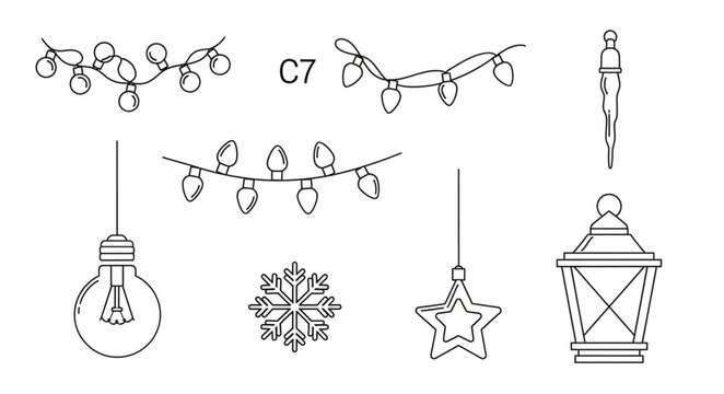 Christmas decorations hang from a string of lights on a snowy night