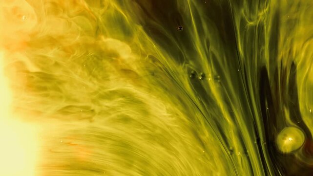 Abstract olive green and yellow fluid art background. Soft smoky ink waves flowing smoothly with tiny bubbles and dynamic marble texture. Perfect for creative background design.