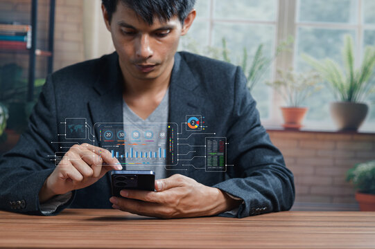 Businessman Analyzing Data on Smartphone with Financial Charts