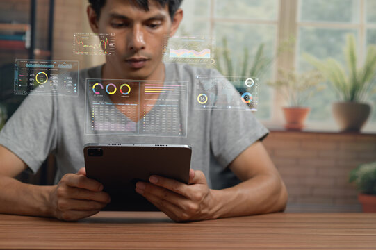 Person Analyzing Digital Data with Tablet in Modern Workspace