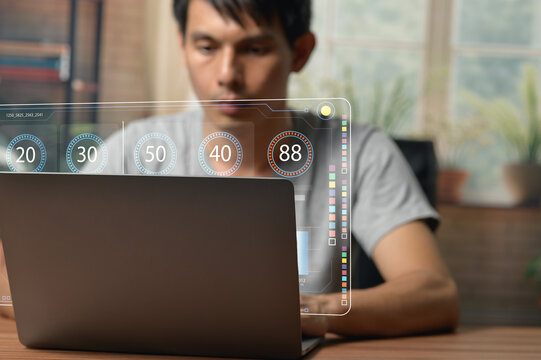 Young Professional Engaged with Digital Chart on Laptop Screen