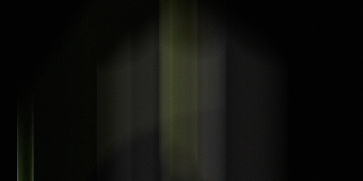 Dark moody background featuring vertical light beams with green tint and heavy film grain for atmospheric cinematic visual design.