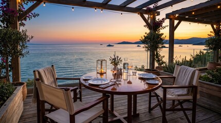 Obraz premium Oceanfront terrace dining table set for evening meal overlooking calm sea at sunset with lanterns and glassware on wooden deck capturing warm coastal mood and relaxed alfresco concept